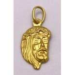 An 18K Yellow Gold Jesus Pendant. 25mm. 1g.