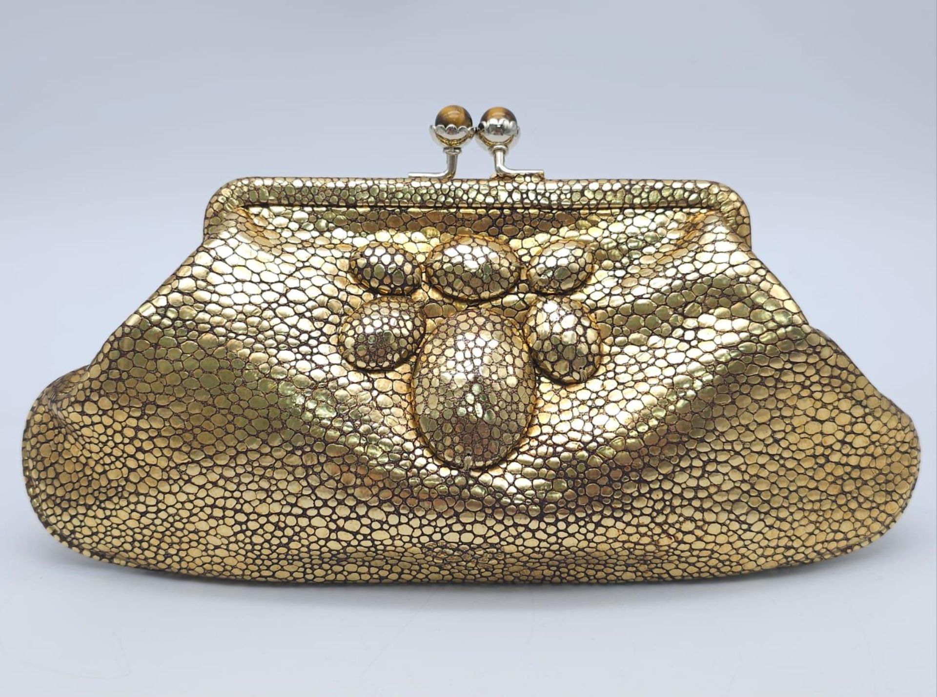 Beautiful Anya Hindmarch Gold Purse. Gold leather exterior with a duo of jewelled top clasps.