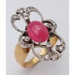 An Art Deco 18K Yellow Gold, Burmese Ruby and Diamond Ring. Size L/M. Ruby cabochon in an old cut