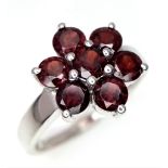 An Excellent Condition Sterling Silver Garnet Set Cluster Ring. Size O. Crown Measures 1.3cm wide.