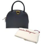 Salvatore Ferragamo Top Hand Bag. Calf leather with rolled top handles, gold tone hardware and two-