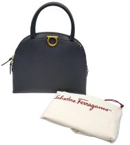 Salvatore Ferragamo Top Hand Bag. Calf leather with rolled top handles, gold tone hardware and two-