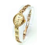 A Vintage 9K Gold RJW Ladies Watch. 9k gold link bracelet. 9K gold oval case - 15mm. Gold tone dial.