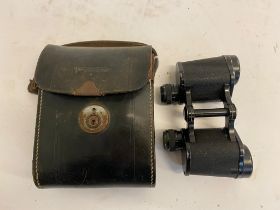 A Pair of WW2 German 6 x 30 Binoculars in Leather Case. Optics are good. The latch on the case are