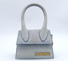 A Jacquemus Duck Egg Blue 'Chiquito' Mini Bag. Croc-embossed leather exterior, with gold toned