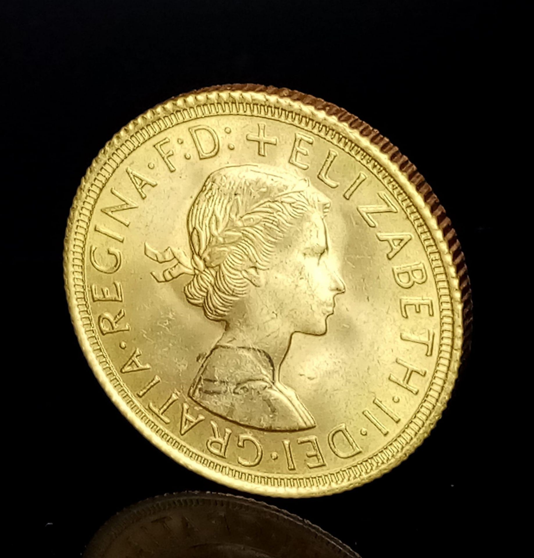 A 1958 Queen Elizabeth II 22K Gold Full Sovereign. EF. - Image 2 of 3