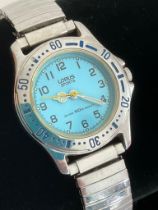 Ladies LORUS SPORTS WATCH . Having attractive blue face with Quartz movement in full working order.