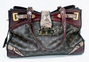 Louis Vuitton Multi-Pattern Handbag. Unique, quality exterior which combines rich burgundy crocodile