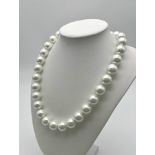 A Bright White South Sea Pearl Shell Necklace. 14mm large beads with a heart clasp. 44cm necklace
