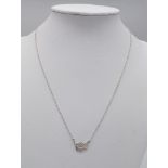 An Alex Monroe Sterling Silver small feather pendant on 18" adjustable chain 2.6g