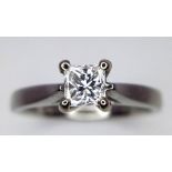 A platinum diamond solitaire ring with a wonderful princess cut diamond (0.43 carats) carrying a