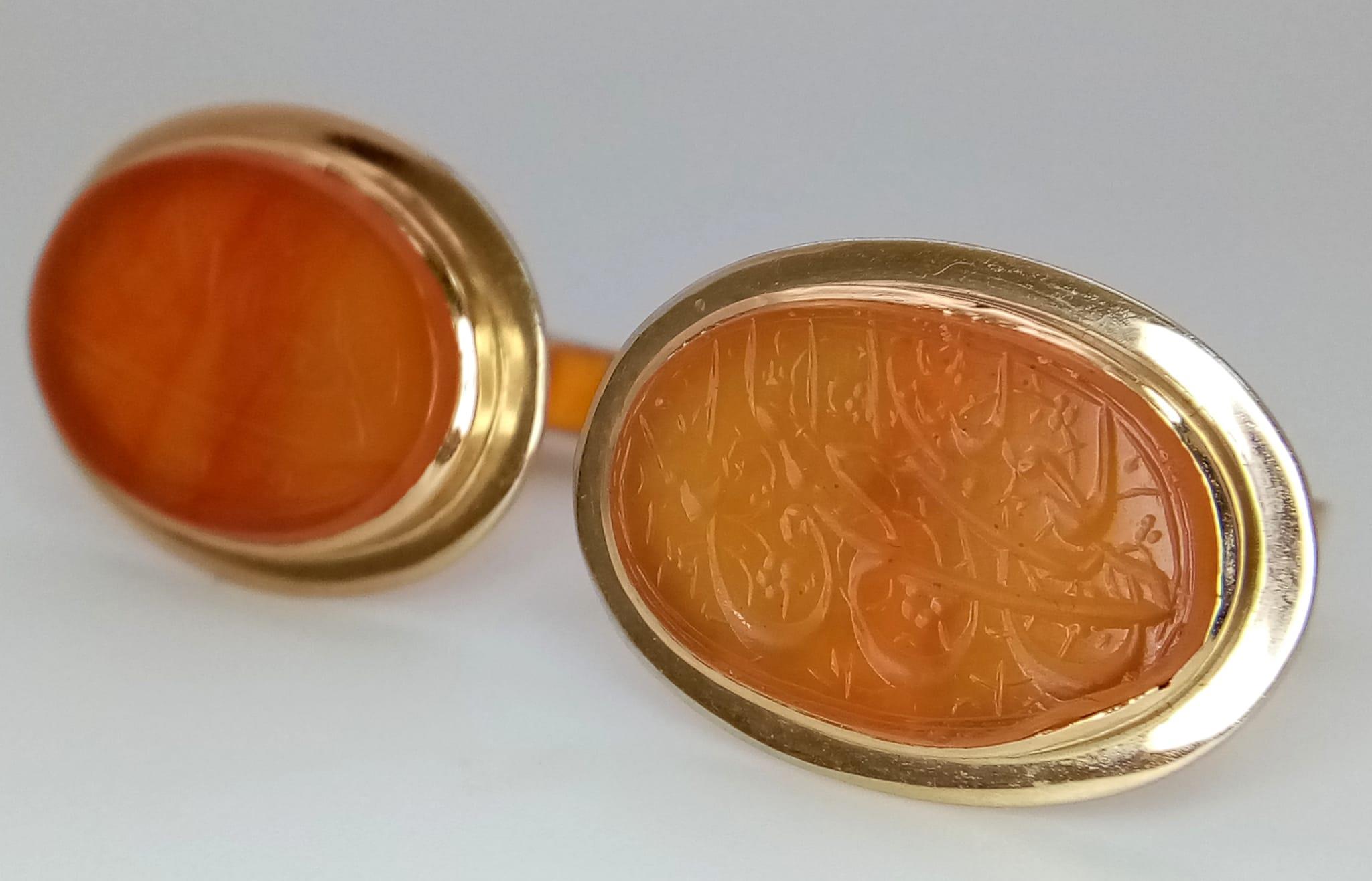A Pair of Vintage 14K Gold Hand-Carved Orange Hardstone Cufflinks. 13.2g total weight.