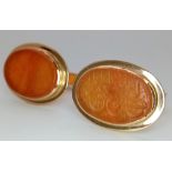 A Pair of Vintage 14K Gold Hand-Carved Orange Hardstone Cufflinks. 13.2g total weight.