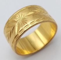 A Rich 22k Yellow Gold Band Ring with Arrowhead and Star Decoration. Size N. 10.7g weight.