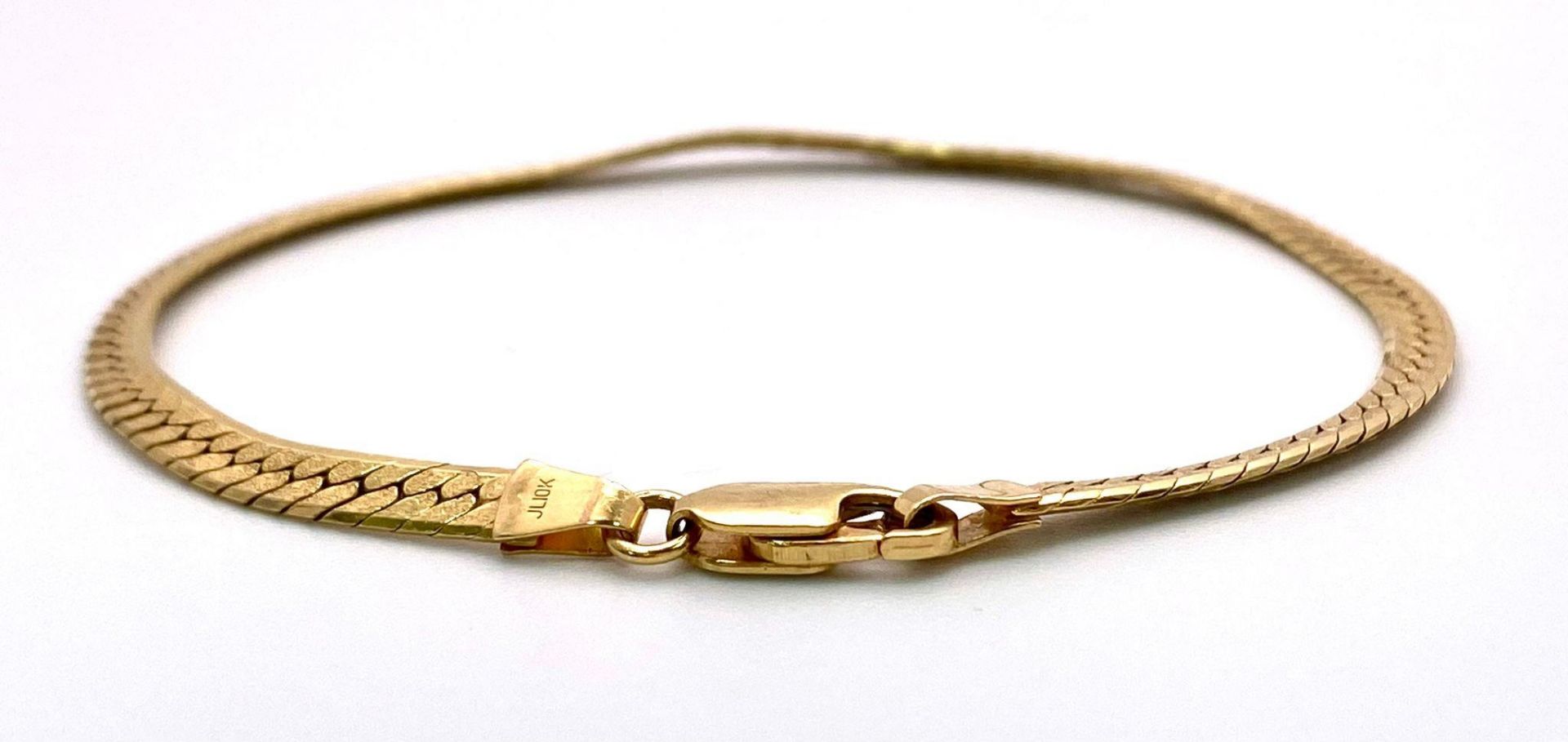 A 10k Yellow Gold Herringbone Bracelet. 17cm. 5g weight. - Image 2 of 4