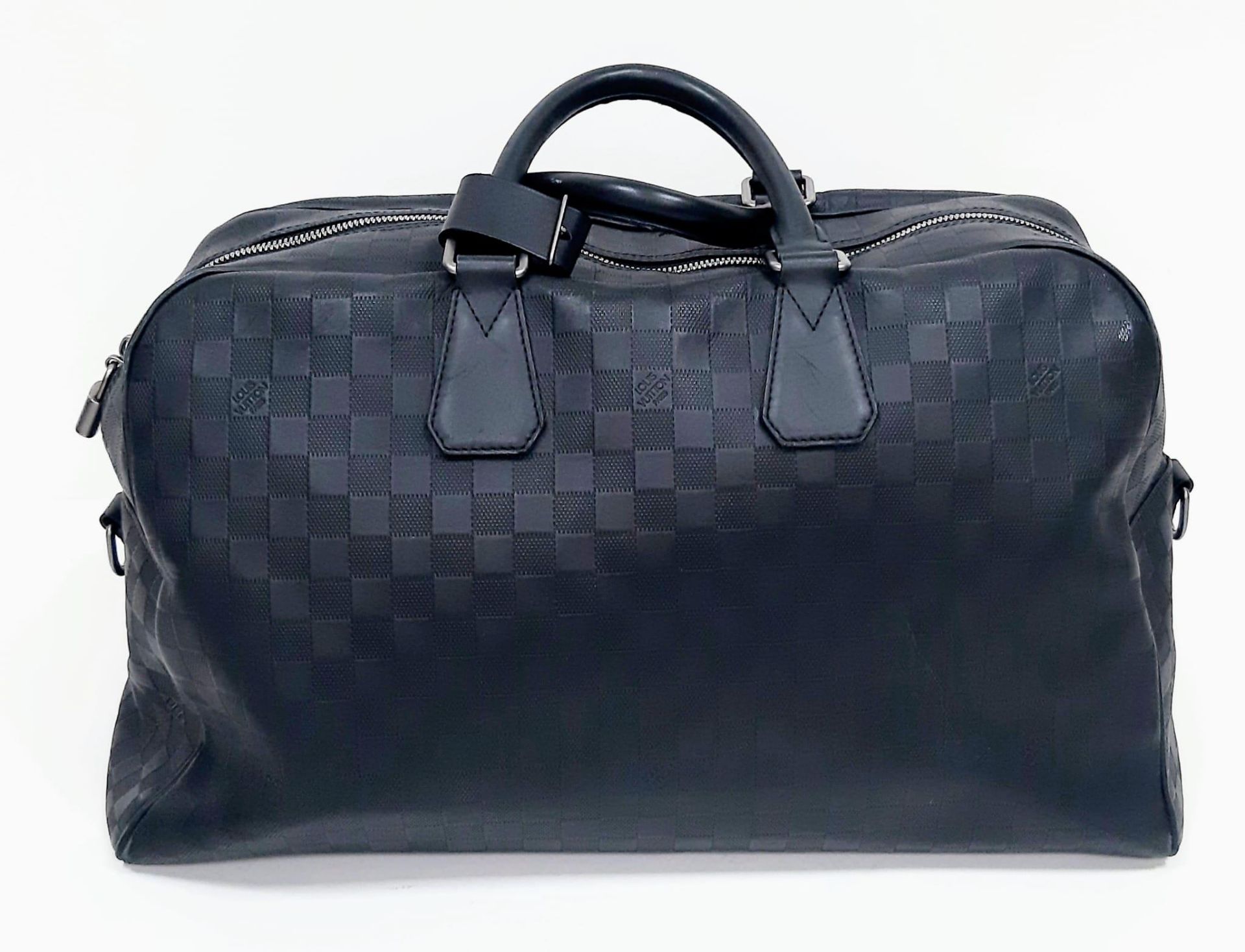 Louis Vuitton Keepall Luggage Bag. Black leather exterior with Silver toned hardware and typical - Image 2 of 8