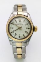 A VINTAGE LADIES ROLEX OYSTER PERPETUAL BI-METAL WRIST WATCH WITH ROMAN NUMERALS AND WHITE DIAL .