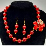 An absolutely fabulous red jade necklace with a show stopping red enamel flower clasp, accompanied