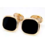 A Pair of Classic Patek Philippe 18K Yellow Gold and Onyx Cufflinks. 14.65g total weight.