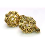 A Pair of Vintage 18K Yellow Gold (tested) and White Stone Earrings. Floral decoration with latch-