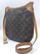 Louis Vuitton Crossover Satchel Bag. Quality leather exterior with famed LV monogrammed pattern.