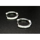 A Pair of 18K White Gold and Diamond Small Hoop Earrings. 1.66g total weight.