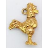 A 9K Yellow Gold Articulated Cock Charm/Pendant. 2cm. 3.33g weight.