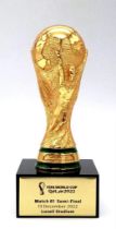 A OFFICIAL FIFA WORLD CUP QATAR 2022 HOSPITALITY TROPHY PRESENTED AT MATCH 61 SEMI FINAL BETWEEN