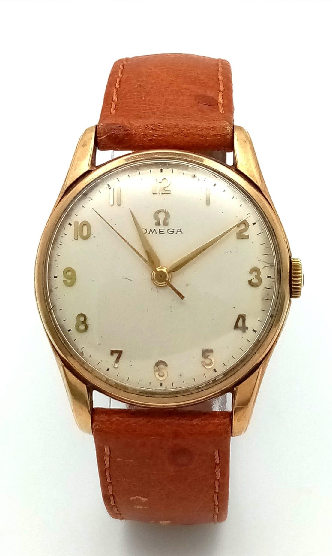 A 9K YELLOW GOLD CASED OMEGA WATCH ON TAN LEATHER STRAP. FULL WORKING ORDER ref: MB 5001