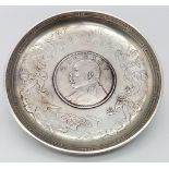 An Antique Chinese Silver, Yuan Coin Set, Dragon & Bat Detail Dish. Circa 1914, it measures 9.3cm