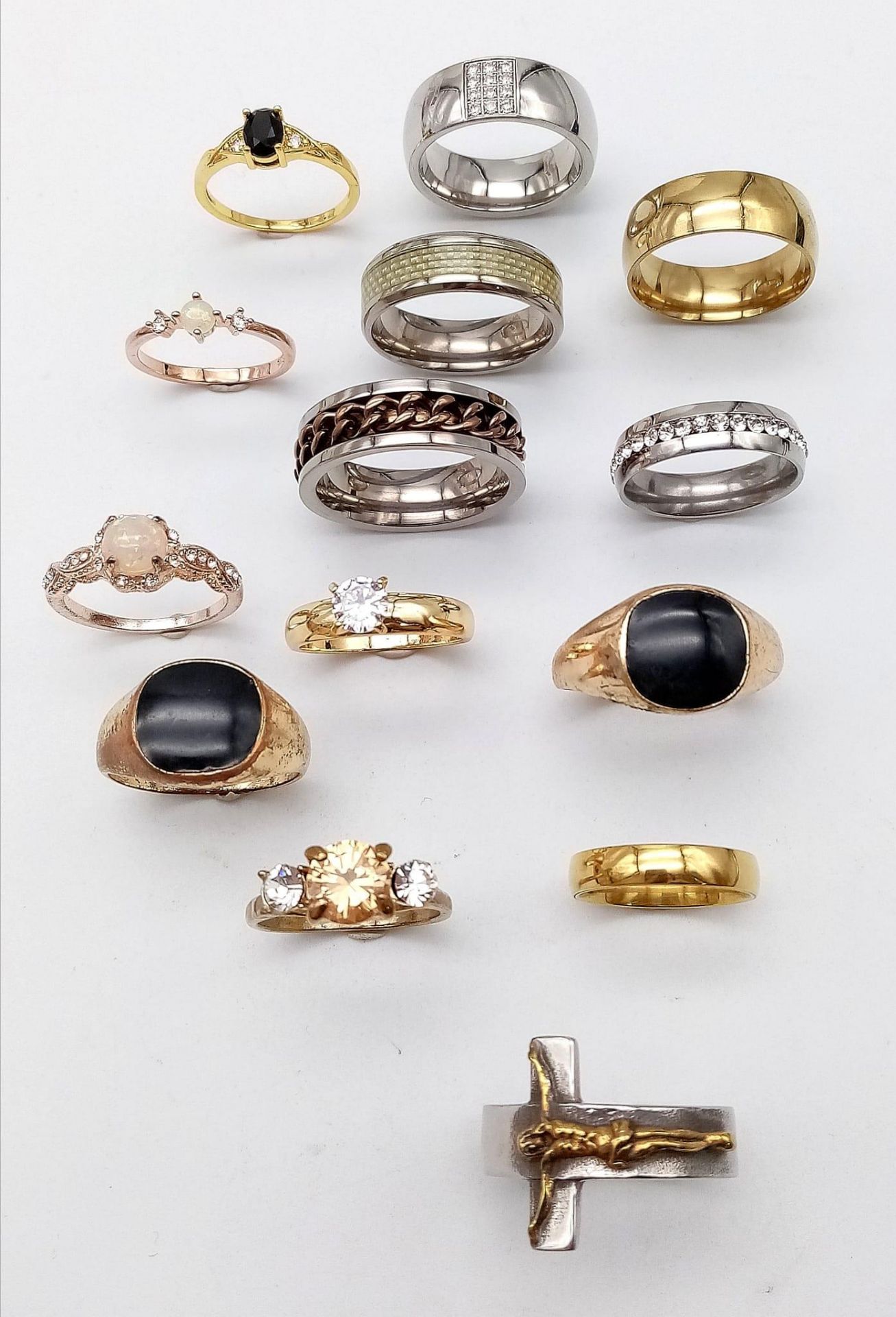 14 Different Style Decorative Rings in Larger Sizes. Set in white and gilded metal.