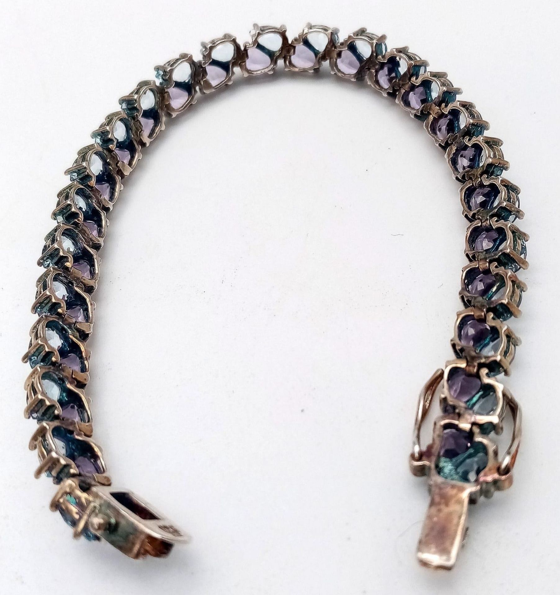 A Sterling Silver, double row bracelet set with Amethyst and Topaz. Measures 20cm in length. Weight: - Image 4 of 10