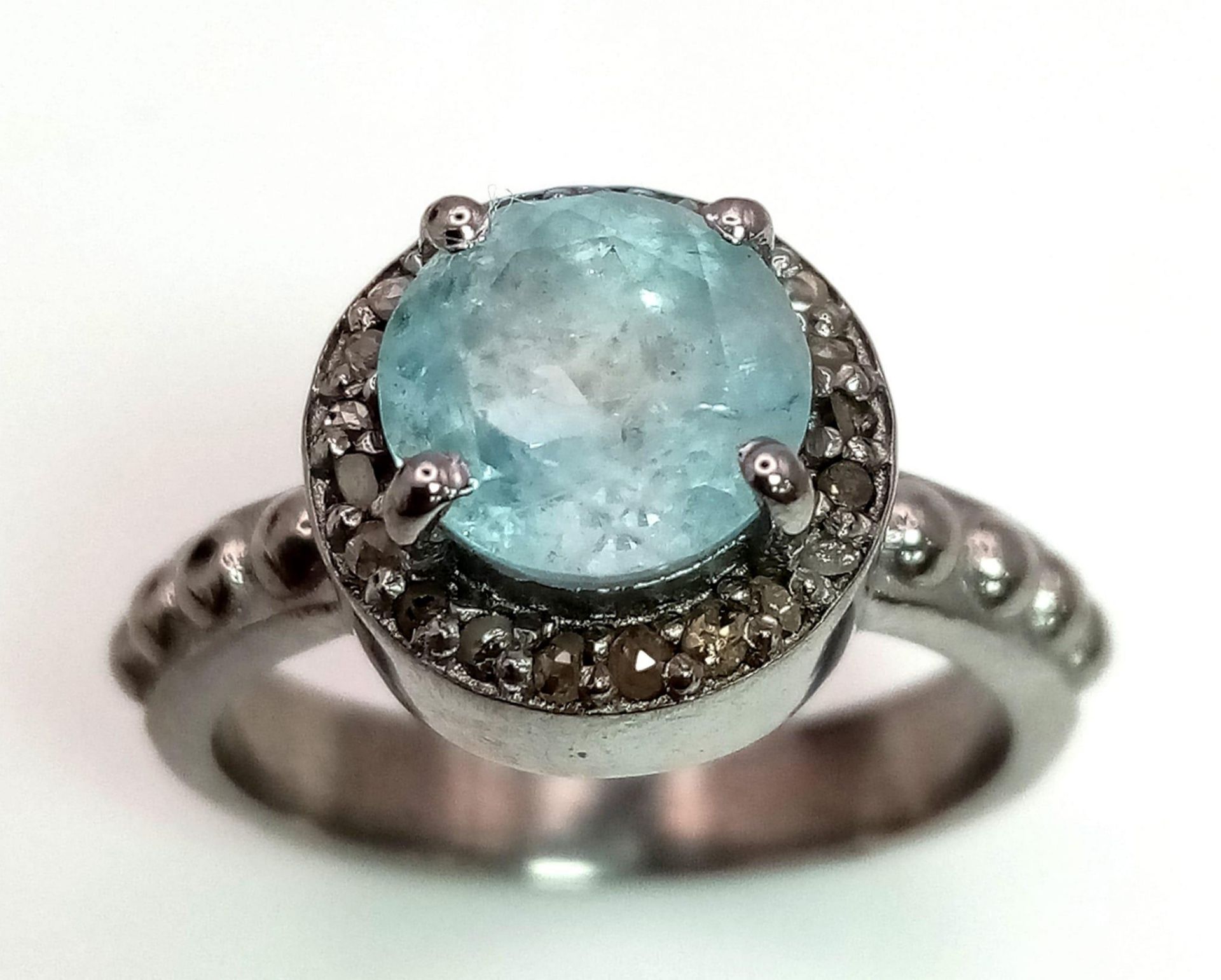 A Blue Topaz Ring with a Rose cut Diamond Halo. Set in 925 Sterling Silver. 1.50ct topaz. Diamond- - Image 2 of 5