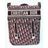 A Christian Dior Burgundy Monogram Backpack. Canvas exterior, with silver toned hardware, flat