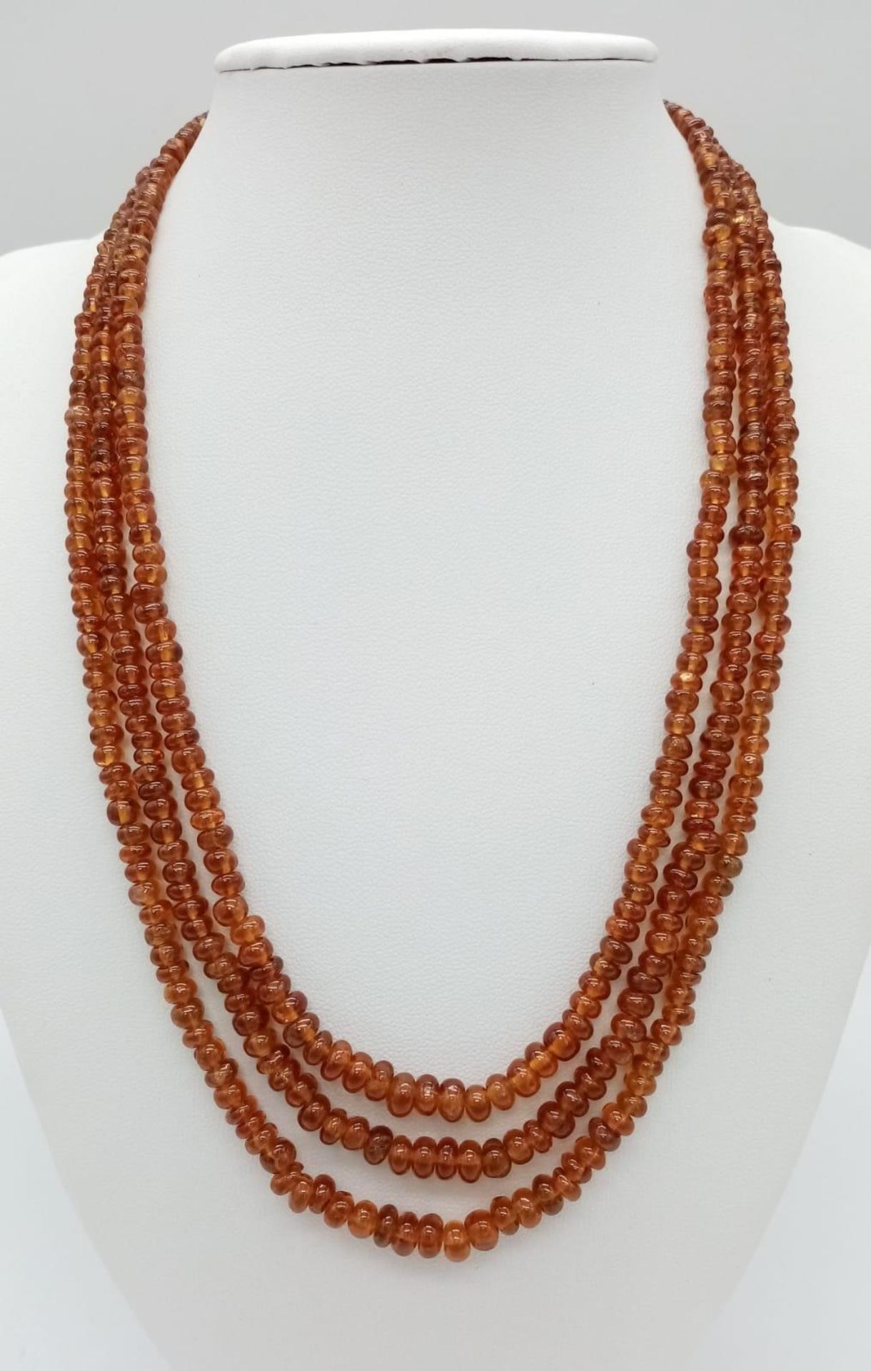 A Three Row Hessonite Garnet Small Rondelle Bead Necklace. 245ctw. 925 Silver Clasp. 40-46cm length. - Image 2 of 3