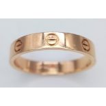 A CARTIER 18K ROSE GOLD SCREW RING . 5gms size U