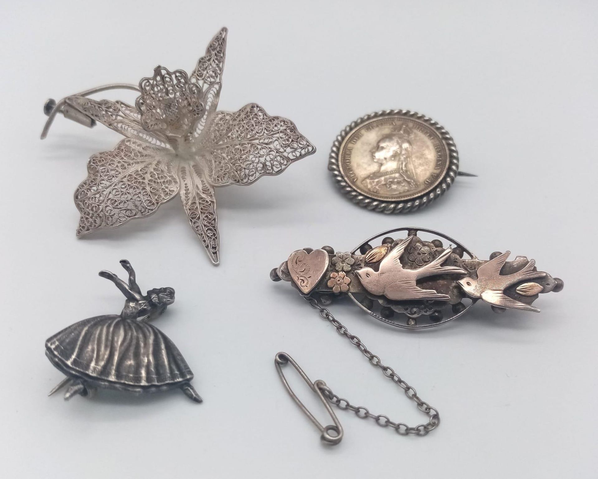 A collection of 3 vintage silver brooches: dancing ballerina, natural art, Victorian Jubilee