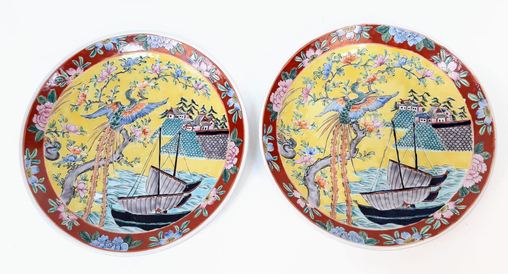 A pair of large, wonderful Chinese Famille Jaune enamelled Plates. Depicting boats, houses and