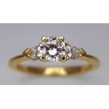 A 18CT YELLOW GOLD DIAMOND 3 STONE RING 0.60CT 2.7G SIZE M/N ref: P176