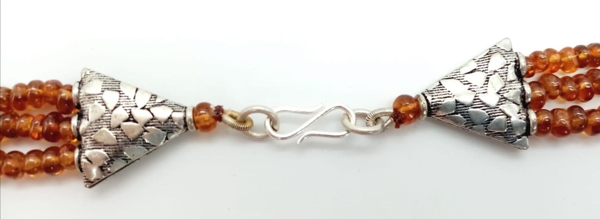 A Three Row Hessonite Garnet Small Rondelle Bead Necklace. 245ctw. 925 Silver Clasp. 40-46cm length. - Image 3 of 3
