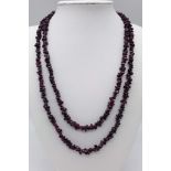 An Ex Display, Sterling Silver T-Bar Garnet Necklace. 100cm Length, can be worn single or doubled.