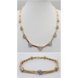 A Gorgeous 18K Gold and Heart-Diamond Necklace and Bracelet Set. The necklace is decorated with