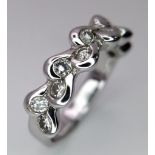 A 18K WHITE GOLD FANCY DIAMOND BAND RING IN THE WAVE DECORATION 0.25CT 5G SIZE N/O ref: JR2 - 27