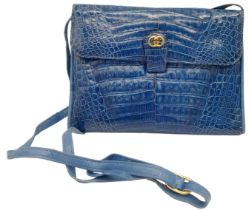 Gucci Blue Crocodile Handbag. Gold tone hardware throughout with soft quality leather. Multiple
