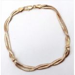 An Attractive 9K Yellow Gold Crossover Bracelet. 19cm. 7.45g weight.