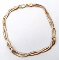 An Attractive 9K Yellow Gold Crossover Bracelet. 19cm. 7.45g weight.