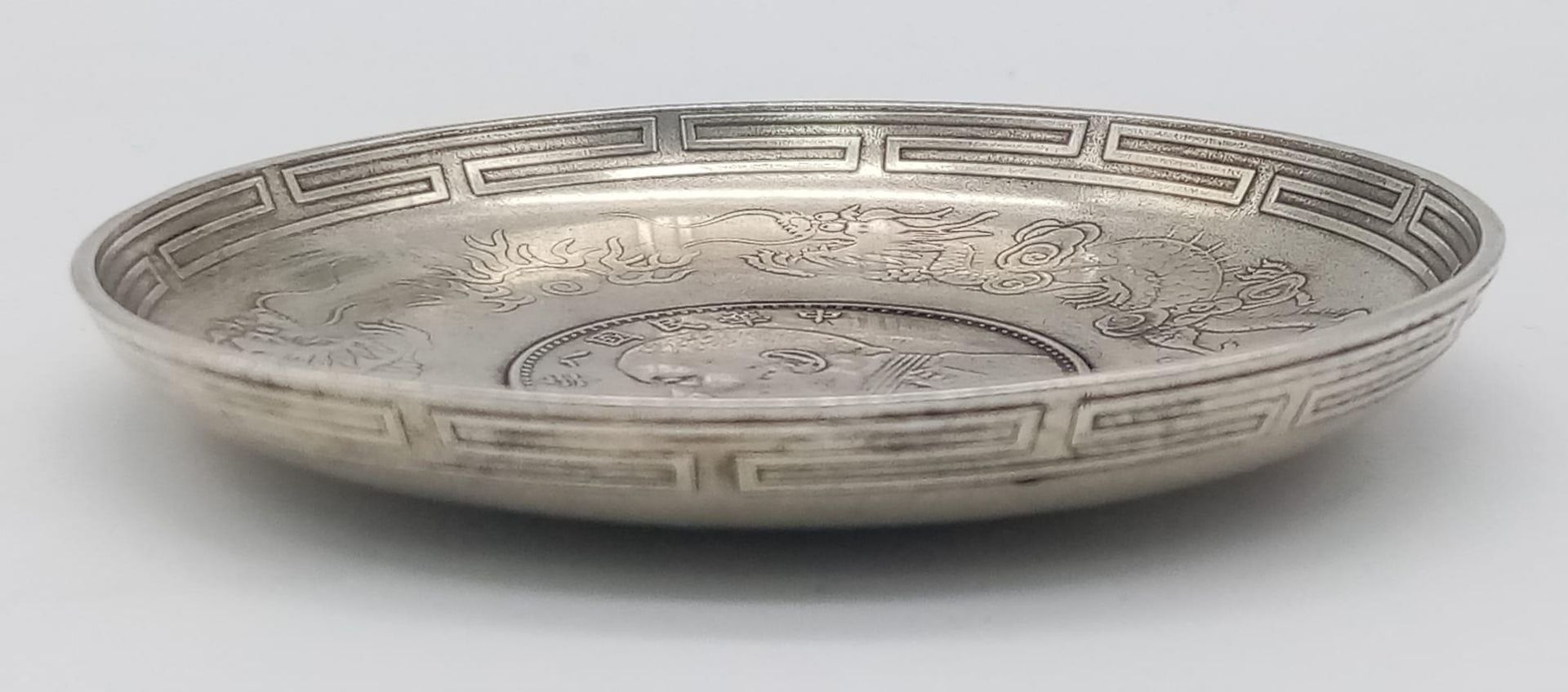 An Antique Chinese Silver, Yuan Coin Set, Dragon & Bat Detail Dish. Circa 1914, it measures 9.3cm - Image 5 of 5