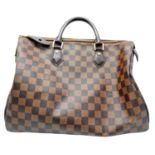 A Louis Vuitton Damier Ebene Speedy 35 Bag. Leather exterior with two rolled leather handles, gold