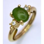 A Vintage 9K Yellow Gold Jade and White Stone Ring. Small central jade cabochon. Size N. 2.31g total