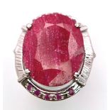 An Oval Ruby Slice 925 Silver Ring with Ruby Accents. Size R. 16.3g total weight. Comes with a